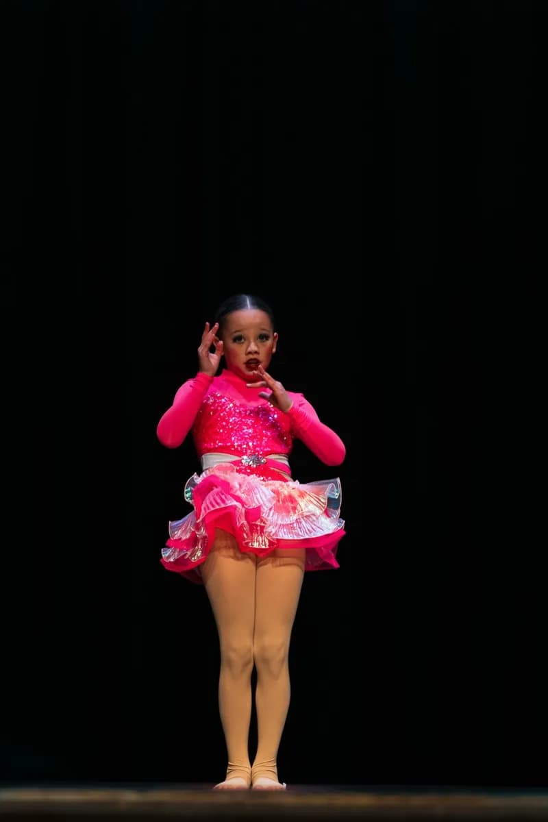 Young dancer in pink costume